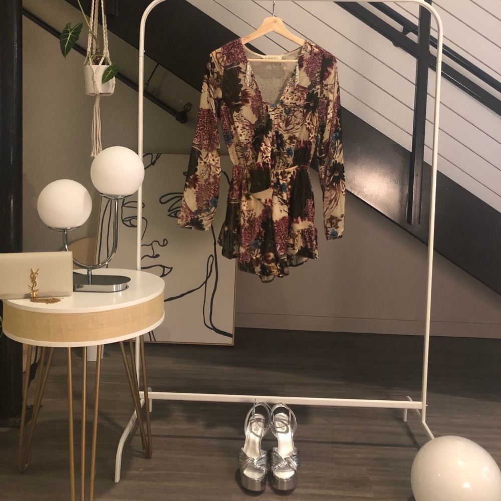 Velvet romper with partial see through fabric.